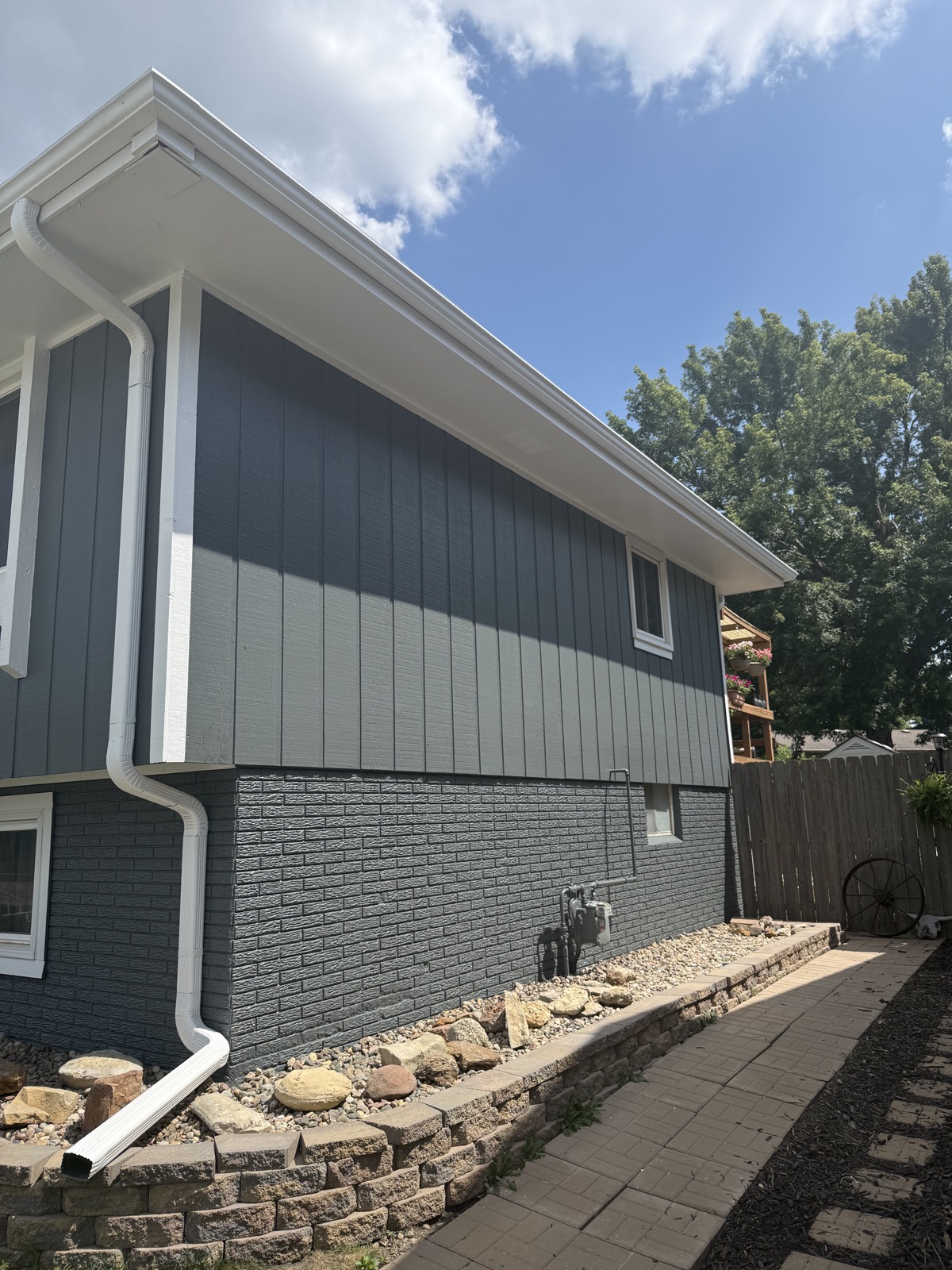 Finished charcoal and white home exterior painted by LNK Painting